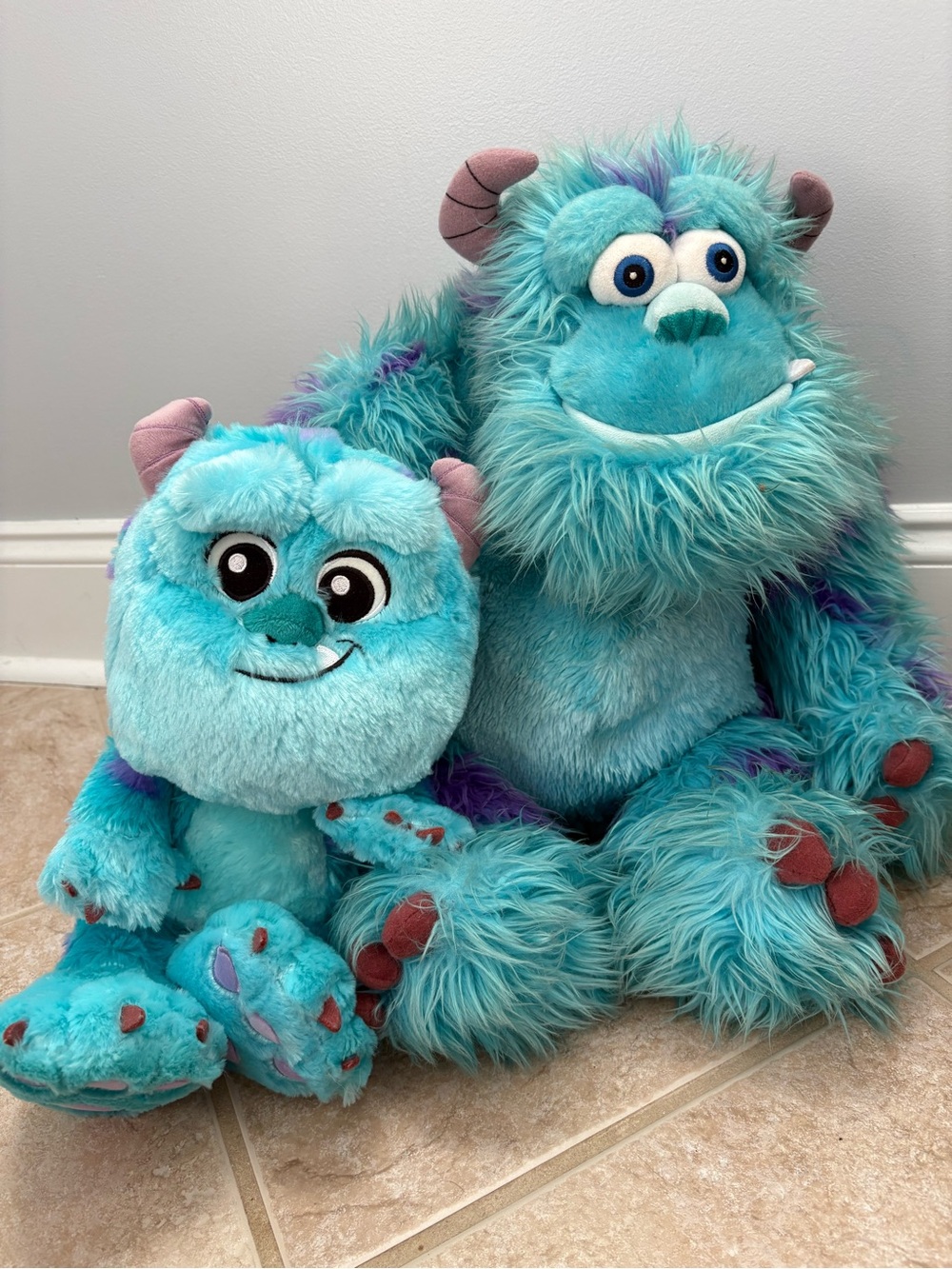 Disney Store plush toys of Sulley from Monsters, Inc.